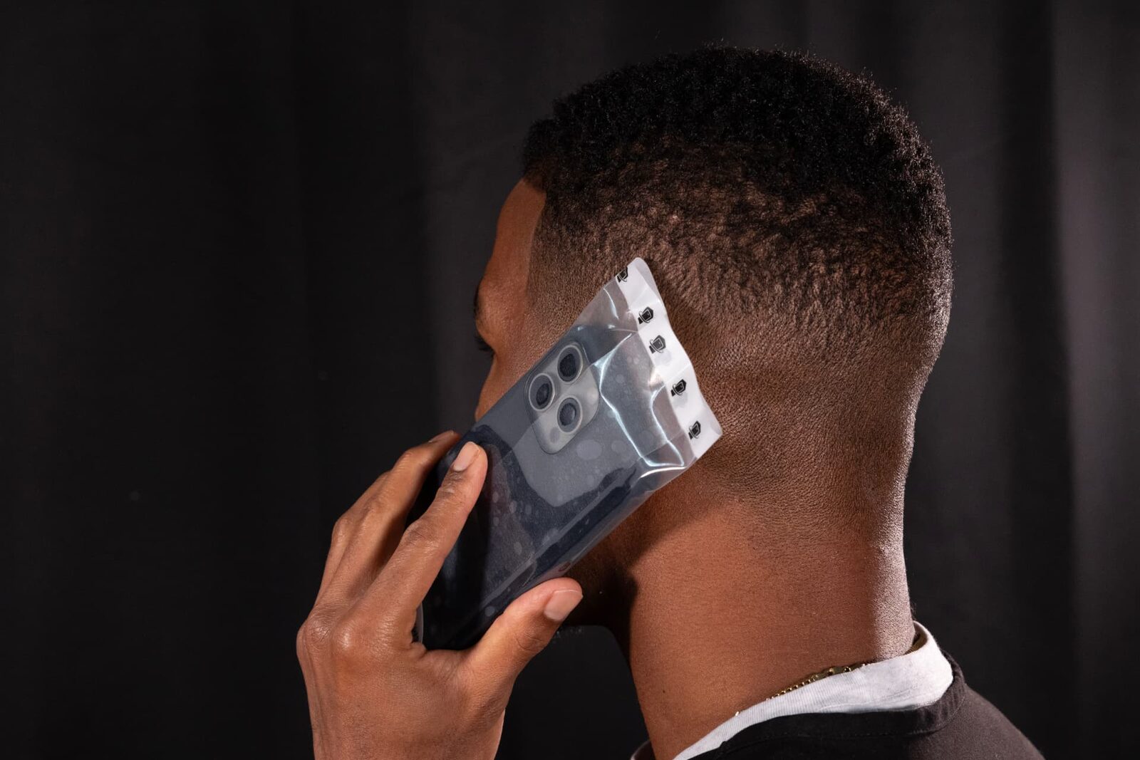 Man taking a call on a WynnShield™-wrapped phone