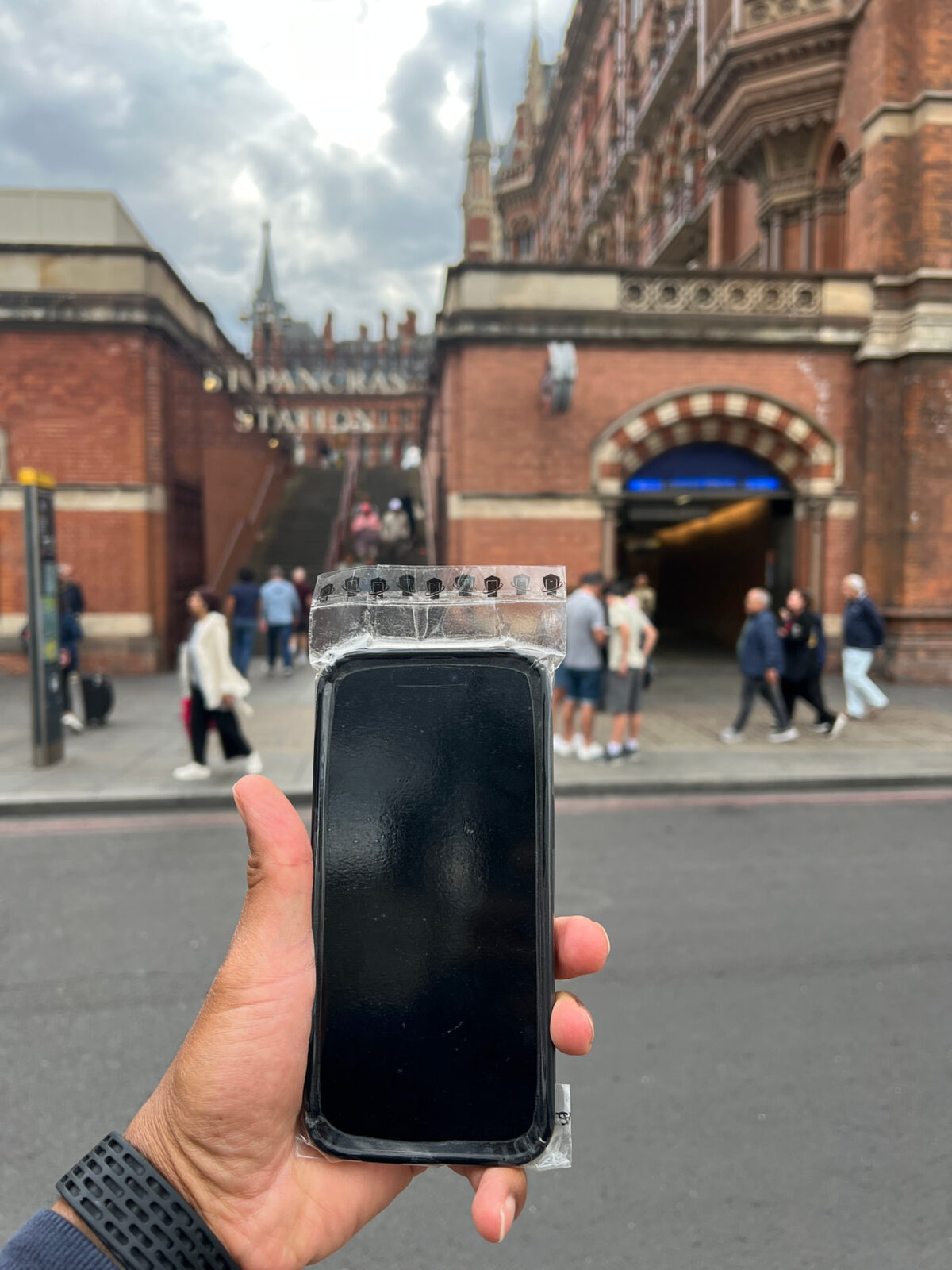 WynnShield™-wrapped phone held outside St Pancras station
